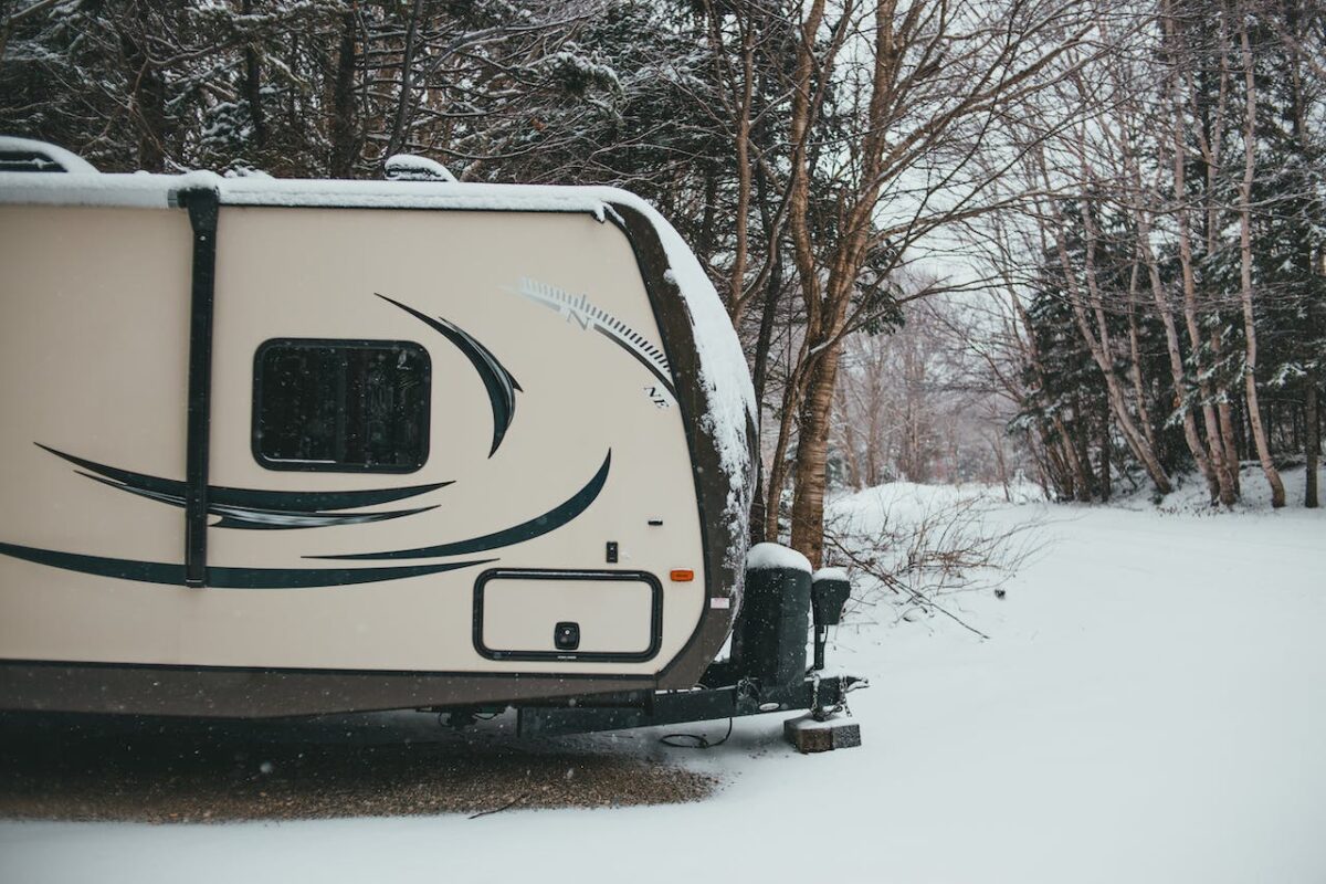 travel-trailer-in-snowy-woods